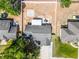 Aerial view of the property showing the house, backyard, fence, and surrounding neighborhood at 15532 Kensington Trl, Clermont, FL 34711