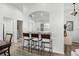Kitchen featuring a breakfast bar with seating, updated lighting, and modern flooring at 15532 Kensington Trl, Clermont, FL 34711