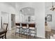 Kitchen featuring a breakfast bar with seating, updated lighting, and modern flooring at 15532 Kensington Trl, Clermont, FL 34711