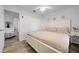 Bright main bedroom featuring a ceiling fan, closet, and ensuite bathroom access at 15532 Kensington Trl, Clermont, FL 34711