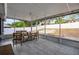 Relaxing screened patio with tile flooring and outdoor seating, ideal for enjoying the backyard view at 15532 Kensington Trl, Clermont, FL 34711