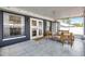Relaxing screened patio with tile flooring and outdoor seating, offering a peaceful outdoor space at 15532 Kensington Trl, Clermont, FL 34711