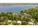 Aerial view of lakefront property with lush landscaping and privacy at 1555 Waterwitch Dr, Orlando, FL 32806