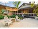 Serene backyard with patio, umbrella, seating, and lush landscaping, perfect for outdoor relaxation at 1555 Waterwitch Dr, Orlando, FL 32806
