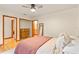 Comfortable bedroom featuring hardwood floors and ensuite bathroom at 1555 Waterwitch Dr, Orlando, FL 32806
