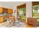 Cozy dining area features a large window with views of the backyard and custom wood cabinetry at 1555 Waterwitch Dr, Orlando, FL 32806