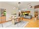 Dining area with hardwood floors, modern lighting, and open floor plan at 1555 Waterwitch Dr, Orlando, FL 32806