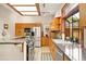 Modern kitchen featuring granite countertops, stainless steel appliances, and custom wood cabinets at 1555 Waterwitch Dr, Orlando, FL 32806
