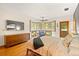 Spacious main bedroom with hardwood floors, ceiling fan and large windows with bay window seating at 1555 Waterwitch Dr, Orlando, FL 32806