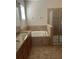 Main bathroom featuring double sinks, granite countertops, and a separate shower and tub at 1711 Penrith Loop, Orlando, FL 32824