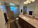 Bathroom featuring a walk-in shower, granite countertops, and a vessel sink at 1720 Hope Dr, Ormond Beach, FL 32174