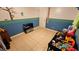 Playful room with cheerful decor, two-tone paint, and neutral tiled floors at 1720 Hope Dr, Ormond Beach, FL 32174