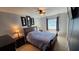 Comfortable bedroom with neutral paint, ceiling fan and window with natural light at 1720 Hope Dr, Ormond Beach, FL 32174