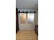 Unique hallway featuring frosted sliding doors and modern tile flooring at 1720 Hope Dr, Ormond Beach, FL 32174