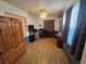 Functional home office with wood floors, ample desk space, and natural lighting at 1720 Hope Dr, Ormond Beach, FL 32174