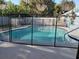 Fenced in-ground swimming pool in backyard offering safety and fun for the Gathering at 1720 Hope Dr, Ormond Beach, FL 32174
