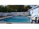 Private in-ground swimming pool with a white fence in a serene backyard setting at 1720 Hope Dr, Ormond Beach, FL 32174