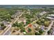 Discover this home from above, showcasing its storage sheds and expansive yard at 18600 Old Cheney Hwy, Orlando, FL 32820