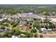 An aerial shot of a home including storage sheds, landscaping, and a sprawling lot at 18600 Old Cheney Hwy, Orlando, FL 32820