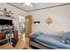 Bedroom with wood floors, ceiling fan, window and closet at 18600 Old Cheney Hwy, Orlando, FL 32820