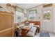 Cozy breakfast nook features a built-in banquette and natural light at 18600 Old Cheney Hwy, Orlando, FL 32820