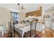 Well-lit dining room with table and chairs, next to the kitchen at 18600 Old Cheney Hwy, Orlando, FL 32820