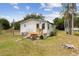 Charming single-story home with a lovely front porch and lush greenery at 18600 Old Cheney Hwy, Orlando, FL 32820