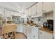 Kitchen featuring white appliances, wooden countertops, and tile floors at 18600 Old Cheney Hwy, Orlando, FL 32820