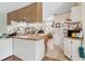 Bright kitchen featuring two-toned cabinets, breakfast bar, and open layout at 18600 Old Cheney Hwy, Orlando, FL 32820