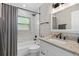 This bathroom includes a granite countertop, an updated sink, and a shower at 197 Flame Ave, Maitland, FL 32751