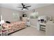 Bedroom with light wood floors, two windows, and a ceiling fan at 197 Flame Ave, Maitland, FL 32751
