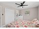 Bedroom showcasing a closet, a window, and a floral bedspread at 197 Flame Ave, Maitland, FL 32751