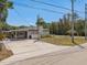 Charming single-story home with a well-maintained lawn and a long, spacious driveway at 197 Flame Ave, Maitland, FL 32751