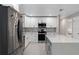 Well-lit kitchen featuring sleek stainless steel appliances, white cabinetry, and stylish countertops at 197 Flame Ave, Maitland, FL 32751