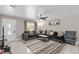 Cozy living room features neutral tones, with a plush sectional sofa and stylish accent rug at 197 Flame Ave, Maitland, FL 32751