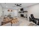 Inviting living room with a brick fireplace, stylish decor, and ample space for relaxation and entertainment at 197 Flame Ave, Maitland, FL 32751