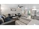 Bright living room featuring an open-concept layout, with tile flooring and views of the kitchen and dining areas at 197 Flame Ave, Maitland, FL 32751