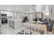 Open floor plan showcases a modern kitchen, dining area, and living room with ample natural light at 197 Flame Ave, Maitland, FL 32751