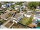 This is an eye-level aerial view of the house showing the yard and a detached outbuilding at 2107 Delaney Ave, Orlando, FL 32806