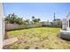 Spacious backyard surrounded by a wooden fence, offering plenty of room at 2107 Delaney Ave, Orlando, FL 32806
