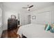 Light bedroom with hardwood floors, closets, and an ensuite bathroom entrance at 2107 Delaney Ave, Orlando, FL 32806