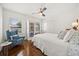 Bedroom with white interior, hardwood floors, closets, and natural light at 2107 Delaney Ave, Orlando, FL 32806