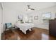 Bright bedroom featuring a ceiling fan, hardwood floors, and natural light from multiple windows at 2107 Delaney Ave, Orlando, FL 32806