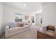 Neutral bonus room featuring a couch, built in book shelves, and good light at 2107 Delaney Ave, Orlando, FL 32806