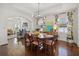 Elegant dining room open to the living room with hardwood floors and stylish curtains at 2107 Delaney Ave, Orlando, FL 32806