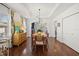 Bright dining room features hardwood floors, modern lighting, and stylish decor at 2107 Delaney Ave, Orlando, FL 32806