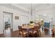 Charming dining room with hardwood floors and modern lighting, perfect for entertaining at 2107 Delaney Ave, Orlando, FL 32806