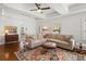Open living room with hardwood floors, a ceiling fan and comfortable seating arrangement at 2107 Delaney Ave, Orlando, FL 32806