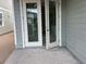 Covered back porch with double doors, perfect for outdoor relaxation at 2342 Broadbrook Drive, St Cloud, FL 34771