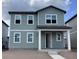 Two-story gray home with multiple windows and covered front porch at 2342 Broadbrook Drive, St Cloud, FL 34771